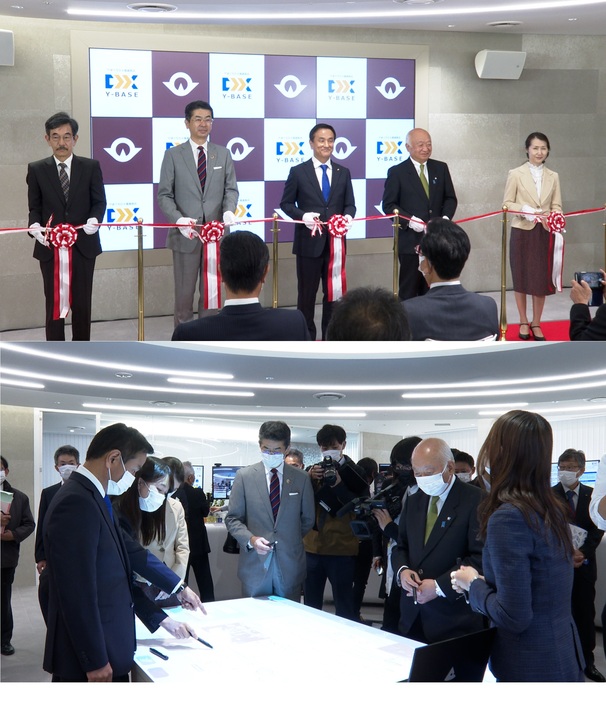 (上)開所式でテープカットに臨む村岡知事の写真(下)デモ展示を体験する村岡知事の写真